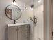 Bathroom featuring a single vanity with a black faucet and a walk-in shower with a black rainfall showerhead at 2562 Tritt Springs Ne Trce, Marietta, GA 30062