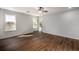 Bright bedroom featuring hardwood floors, neutral paint, a ceiling fan and large windows providing natural light at 2562 Tritt Springs Ne Trce, Marietta, GA 30062