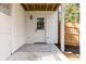 Covered back door and concrete slab with classic light fixture, wood fence at 2562 Tritt Springs Ne Trce, Marietta, GA 30062