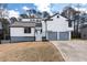 Beautifully renovated home with a fresh white exterior, gray accents, and a spacious two-car garage at 2562 Tritt Springs Ne Trce, Marietta, GA 30062