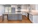 Modern kitchen with stainless steel appliances, granite counters, a center island, and hardwood flooring at 2562 Tritt Springs Ne Trce, Marietta, GA 30062