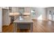 Kitchen featuring white cabinets, granite countertops, stainless appliances, and a large gray island at 2562 Tritt Springs Ne Trce, Marietta, GA 30062