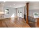 Bright open-concept living room with hardwood floors and doors leading to the outdoor deck at 2562 Tritt Springs Ne Trce, Marietta, GA 30062