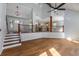 Elegant living space featuring hardwood floors, staircase, high ceilings and an open view to kitchen at 2562 Tritt Springs Ne Trce, Marietta, GA 30062