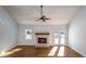 Living room features a cozy fireplace, hardwood floors, and access to the outdoor deck at 2562 Tritt Springs Ne Trce, Marietta, GA 30062