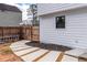Charming side yard features a stepping stone path and wooden fence for privacy at 2562 Tritt Springs Ne Trce, Marietta, GA 30062