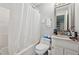 Cozy bathroom with white tiled tub/shower combination and vanity sink at 2724 Long Lake Ne Dr, Roswell, GA 30075