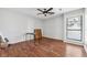 Bright bedroom with hardwood floors, ceiling fan, and large windows at 2724 Long Lake Ne Dr, Roswell, GA 30075