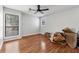 Bedroom with a ceiling fan, hardwood floors and plenty of natural light at 2724 Long Lake Ne Dr, Roswell, GA 30075