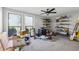 Large bedroom with carpet, shelving and windows providing lots of natural light at 2724 Long Lake Ne Dr, Roswell, GA 30075
