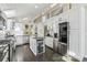 Bright kitchen with white cabinets, stainless steel appliances and an island at 2724 Long Lake Ne Dr, Roswell, GA 30075