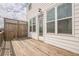 Spacious back deck with wood railing, offers an outdoor living space, and natural light at 4565 Sims Park Overlook, Suwanee, GA 30024