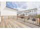 Back deck features natural wood and a view of the neighboring homes at 4565 Sims Park Overlook, Suwanee, GA 30024