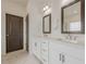 Elegant bathroom with double vanities, white countertops, and stylish fixtures, perfect for a relaxing morning routine at 4565 Sims Park Overlook, Suwanee, GA 30024