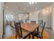 Open concept dining area flows into a modern kitchen with stainless steel appliances and plenty of natural light at 4565 Sims Park Overlook, Suwanee, GA 30024