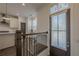 Inviting entryway with hardwood floors and a view of the modern kitchen beyond at 4565 Sims Park Overlook, Suwanee, GA 30024