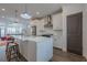 Bright kitchen with stainless steel appliances, white cabinetry, and an island with bar seating at 4565 Sims Park Overlook, Suwanee, GA 30024