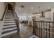 Open-concept living space with stairs, modern kitchen, dining area and living room at 4565 Sims Park Overlook, Suwanee, GA 30024