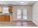 Cozy eat-in kitchen nook with wood-look floors and access to the backyard at 667 Oaktree Park Ct, Lawrenceville, GA 30044