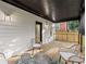 Covered back deck complete with outdoor seating at 99 Brown Ave, Atlanta, GA 30315