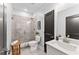 Modern bathroom featuring a tiled shower, white vanity, and sleek fixtures at 99 Brown Ave, Atlanta, GA 30315