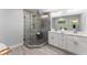 Modern bathroom featuring a glass enclosed shower and double sink vanity at 99 Brown Ave, Atlanta, GA 30315