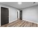 Empty bedroom with wood floors and modern gray trim and gray doors at 99 Brown Ave, Atlanta, GA 30315