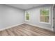 Bright and airy bedroom with two windows and modern flooring at 99 Brown Ave, Atlanta, GA 30315