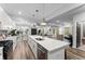 Modern kitchen with white cabinets, quartz countertops, stainless steel appliances, and large island perfect for cooking at 99 Brown Ave, Atlanta, GA 30315