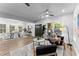 Open-concept living area with dining space, featuring lots of natural light and ceiling fan at 99 Brown Ave, Atlanta, GA 30315