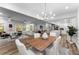 Spacious living and dining area with open floorplan and modern decor and lots of light at 99 Brown Ave, Atlanta, GA 30315
