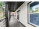 Covered front porch with black trim, contemporary railing and lighting fixtures, perfect for enjoying the outdoors at 99 Brown Ave, Atlanta, GA 30315