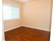 Bedroom featuring wood-look flooring, natural light, and neutral colors at 5164-0 Phillips Dr, Forest Park, GA 30297