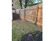Backyard with a wooden fence, grass, and potential for landscaping at 1076 Grant Se Way, Atlanta, GA 30315