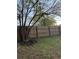 Backyard featuring a well-maintained wooden fence with trees and green grass at 1076 Grant Se Way, Atlanta, GA 30315
