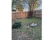 Fenced backyard with trees, grass, and potential for gardening or outdoor activities at 1076 Grant Se Way, Atlanta, GA 30315