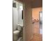 Bathroom with a standard toilet and sink next to an arched entrance into a dining area at 1076 Grant Se Way, Atlanta, GA 30315