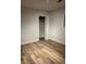 Bedroom features wood-look flooring and a closet with bi-fold doors at 1076 Grant Se Way, Atlanta, GA 30315