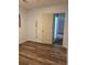 Bedroom with light walls and wood flooring with a door leading to the hall at 1076 Grant Se Way, Atlanta, GA 30315