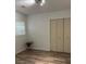 Bedroom with light walls and wood flooring featuring a double door closet at 1076 Grant Se Way, Atlanta, GA 30315
