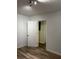 Bedroom with light walls and wood flooring featuring an open doorway to the bathroom at 1076 Grant Se Way, Atlanta, GA 30315
