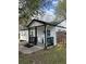Charming home featuring a covered front porch with black trim and a welcoming blue front door at 1076 Grant Se Way, Atlanta, GA 30315