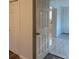 Hallway with closet doors leading into an open doorway with kitchen view at 1076 Grant Se Way, Atlanta, GA 30315