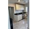 Kitchen with white cabinets, stainless steel appliances, and black countertops at 1076 Grant Se Way, Atlanta, GA 30315