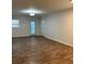 Spacious living room with modern wood-look flooring and plenty of natural light at 1076 Grant Se Way, Atlanta, GA 30315