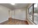Bright bedroom featuring wood-look floors and a large window with a view at 1809 Fairpointe Trce, Stone Mountain, GA 30088