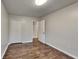 Bedroom with wood-look flooring and closet, offering a stylish and functional space at 1809 Fairpointe Trce, Stone Mountain, GA 30088