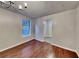 Dining room featuring hardwood floors, natural light and a modern chandelier at 1809 Fairpointe Trce, Stone Mountain, GA 30088