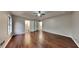 Spacious main bedroom with wood floors, a ceiling fan, and an ensuite bathroom at 1809 Fairpointe Trce, Stone Mountain, GA 30088