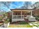 Inviting backyard with a covered patio, white railing, and a well-maintained lawn area at 2795 Kimmeridge Dr, Atlanta, GA 30344